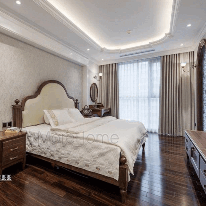 Giường ngủ gỗ óc chó với thiết kế đầu giường bọc da màu trắng góp phần tạo nên vẻ đẹp sang trọng cho không gian căn phòng của gia chủ.